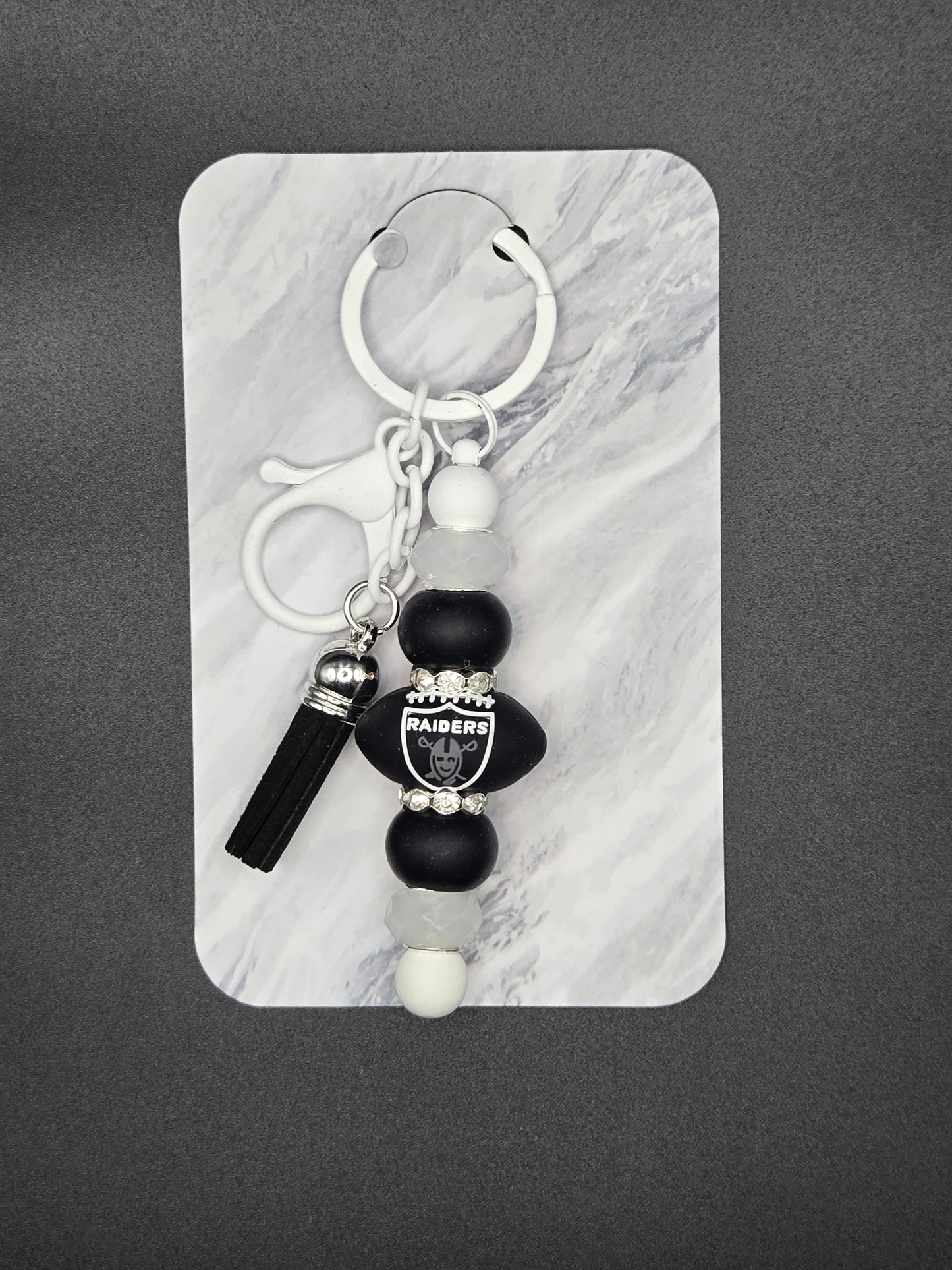 White raiders football keychain