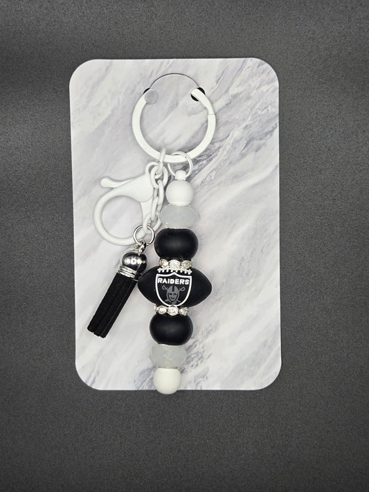 White raiders football keychain